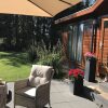 Отель Chalet in Holiday Park With Spacious Living Room, Large Enclosed Garden and Unobstructed View, фото 22