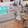 Отель Comfortable apartment in a quiet area, private terrace, shared swimming pool, фото 9