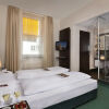 Отель VISIONAPARTMENTS Zurich Hotel Flemings, фото 4