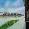 Отель Wuzhen Riverside Boutique Hostel, фото 5