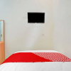 Отель OYO 90804 Oma Uti Homestay Syariah, фото 24