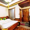 Отель Dielianhua Cowherd Inn Zhangjiajie, фото 44