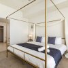 Отель TWO Luxurious Condos Same Floor by Cozysuites, фото 26