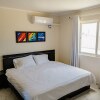 Отель Gorgeous 2-bedroom Apartment 2 km From Eagle Beach, фото 3