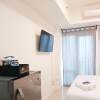 Отель Cozy And High Floor Studio Room At Vida View Makassar Apartment, фото 8