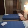 Отель OYO HOME 90700 Teluk Batik Holiday Apartment, фото 8