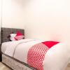 Отель OYO 1557 Bungas Guest House, фото 6