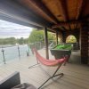 Отель Woodpecker Log Cabin with hot tub, pizza oven bbq entertainment area, lakeside with private fishing , фото 33