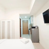 Отель Cozy And High Floor Studio Room At Vida View Makassar Apartment, фото 10