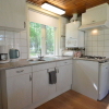 Отель Detached bungalow with lovely covered terrace in a nature rich holiday park, фото 2