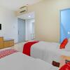 Отель OYO 3905 Graha 100 Guest House Syariah, фото 11