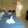 Отель OYO HOME 90700 Teluk Batik Holiday Apartment, фото 26