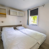 Отель Well-maintained chalet on the outskirts of a holiday park, near Amsterdam, фото 1