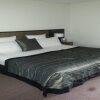 Отель Quay West Suites Melbourne в Мельбурне