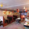 Отель Dragon's Den Hotel, фото 8
