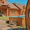 Отель Executive Plus 52 - Beautiful Spacious log Home With Private hot tub Pool в Миль-Иль