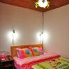 Отель Lijiang Xunniuge Guest House, фото 16