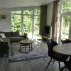 Отель Modern chalet with beautiful garden, located in a holiday park by the forest, фото 8