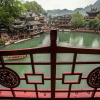 Отель Fenghuang Lanqiju River View Stilt House B&B, фото 13