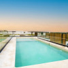 Отель Luminous Private Pool Condo & Communal Rooftop Pool Lounge, фото 10