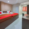 Отель RedDoorz Plus At Pelita Guest House, фото 1