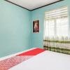 Отель OYO Homes 91148 Homesstay Desa Wisata Bahoi, фото 12