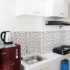 Отель New Homey Studio At Puncak Cbd Apartment, фото 11