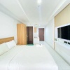 Отель Cozy And Spacious Studio Room At Mekarwangi Square Apartment, фото 1