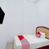 Отель OYO 90387 Sepakat Guest House, фото 2