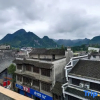 Отель Huaxi Wanjia Homestay, фото 2
