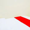 Отель Super OYO Flagship 90723 Berlima Guest House Syariah, фото 2