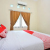 Отель OYO 722 Uno Guesthouse, фото 6