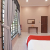 Отель OYO Home 90448 Nurbayu Guest House, фото 22