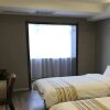 Отель Home Inn Shenyang Xinmin Liaohe Street, фото 3