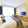 Отель Yantai Tianma International Apartment, фото 4