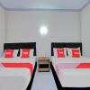 Отель OYO 90520 Kuta Family Guest House, фото 15