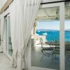 Отель The apartment is located in the first row and directly overlooks the sea, being on the first floor a, фото 13
