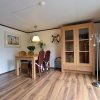 Отель Chalet in Holiday Park With Spacious Living Room, Large Enclosed Garden and Unobstructed View, фото 20