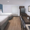 Отель Woodspring Suites Rochester Greece, фото 3