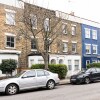 Отель Cosy 2BR Family Home in Battersea, фото 1