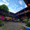 Отель Yiyuan Snow Mountain View Courtyard Inn (Lijiang ancient city mufu branch), фото 1