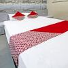 Отель OYO 91202 Family Guest House Syariah, фото 16