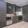 Отель QV Modern Upscale Apartment w Wifi 1046, фото 1
