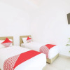 Отель OYO 2896 Uma Menuh Guest House Near Pantai Keramas, фото 18