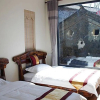 Отель Dali Shuanglang Mafengwo Inn, фото 1