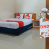 Отель OYO 1448 Mangga Dua Guest House, фото 12