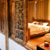 Отель Shangri-La Wenqu Alley Shan Yuan Homestay, фото 19