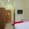 Отель OYO 335 Wisma Empat Lima Syariah, фото 6