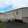 Отель Newquay Bay Porth Caravan - 3 Bed в Ньюквее
