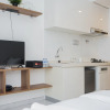 Отель Nice And Comfort Studio Room At Sky House Bsd Apartment, фото 1